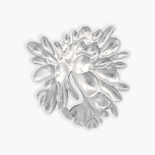 A close-up image of the 'Garden' lapel pin, showcasing a burst of delicate sterling silver petals meticulously hand-chased and repoussed. The pin measures 1 inch and offers versatile styling options, suitable for lapels, ties, hats, or bags.