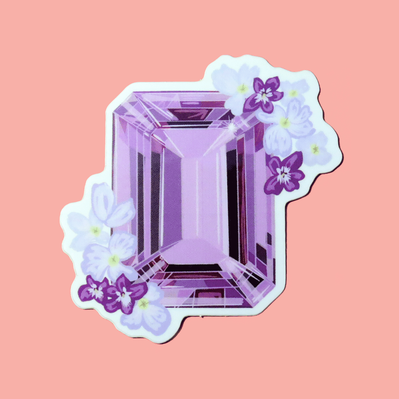 Sticker showcasing an illustrated February birthstone of amethyst and birth flowers of violets and primrose