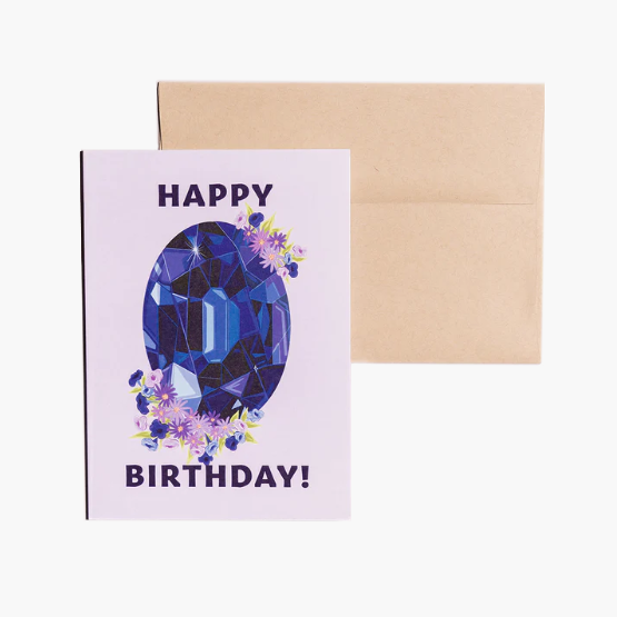 Happy Birthday card showcasing an illustrated September birthstone of sapphire and birth flowers of aster and morning glory.