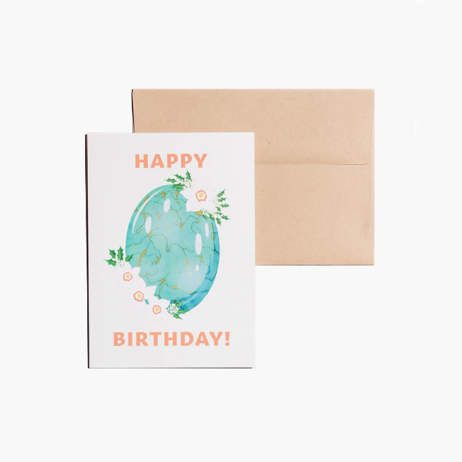 Happy Birthday card showcasing an illustrated December birthstone of turquoise and birth flowers of holly and narcissus.