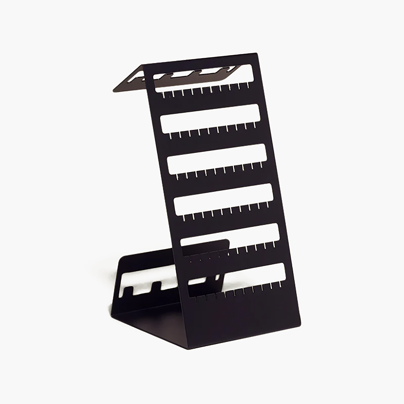 Versatile tabletop jewelry organizer in black featuring compartments for earrings, hooks for necklaces, and slots for rings. 