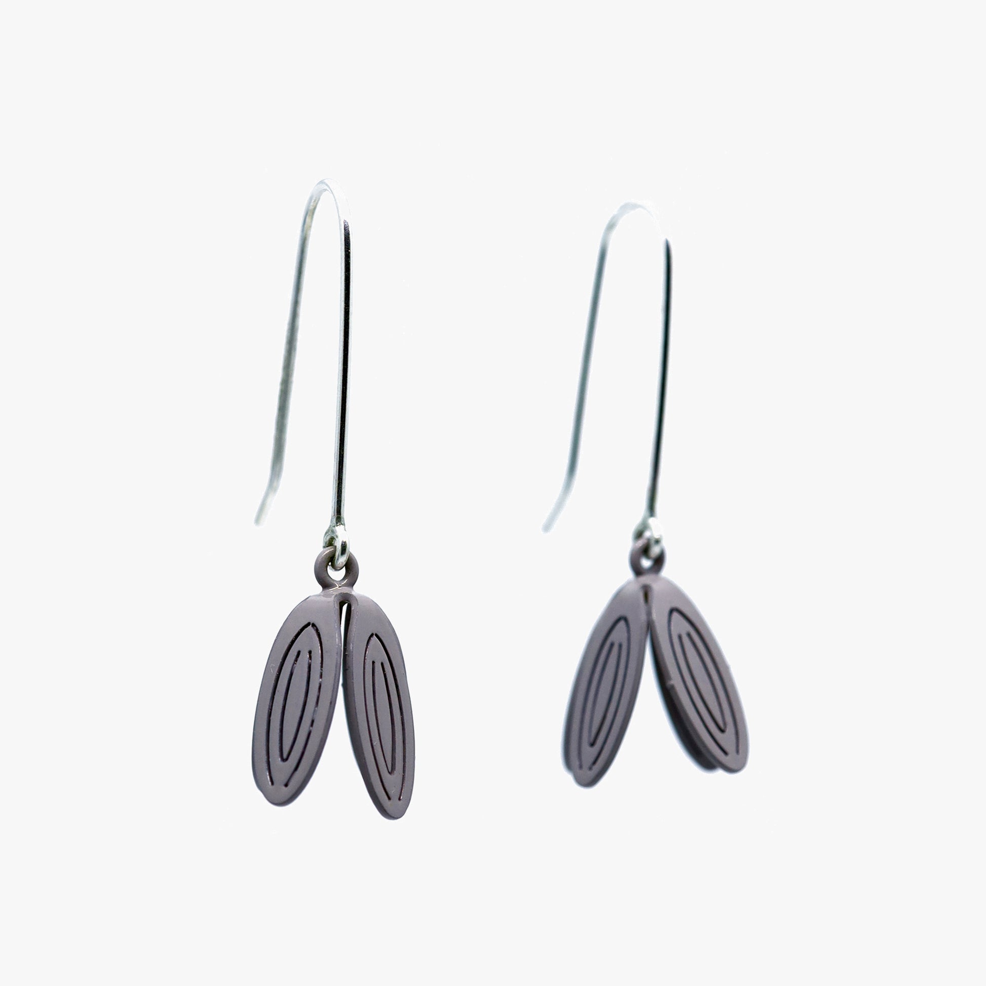 Stunning Petal Drop Earrings by Sorrel Van Allen. Recycled sterling silver and powder-coated brass construction. Intricate laser-cut petals hand-folded for elegant movement. Versatile accessory for casual or formal wear. 