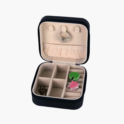Small square black travel jewellery case with a zipper. 