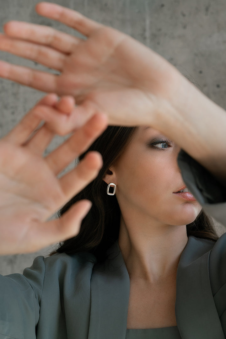 Model wearing sterling silver BERO earrings by Kim Paquet