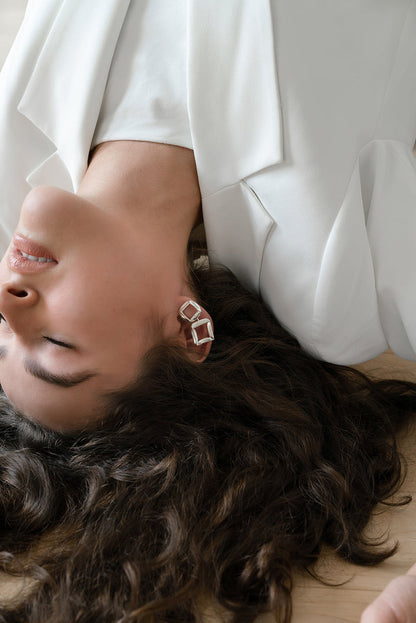 Model wearing sterling silver RAFO earrings by Kim Paquet
