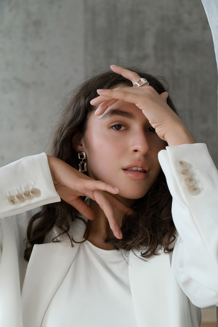 Model wearing sterling silver RAFO earrings by Kim Paquet