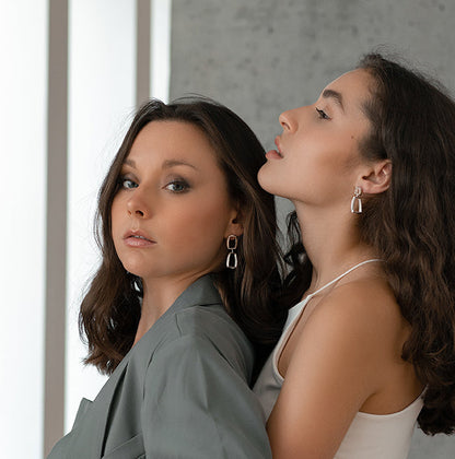 Models wearing sterling silver HANO earrings by Kim Paquet