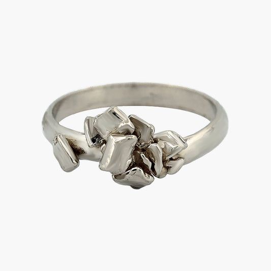 A stackable 'rock' ring in sterling silver, featuring textured surface and minimalist design.