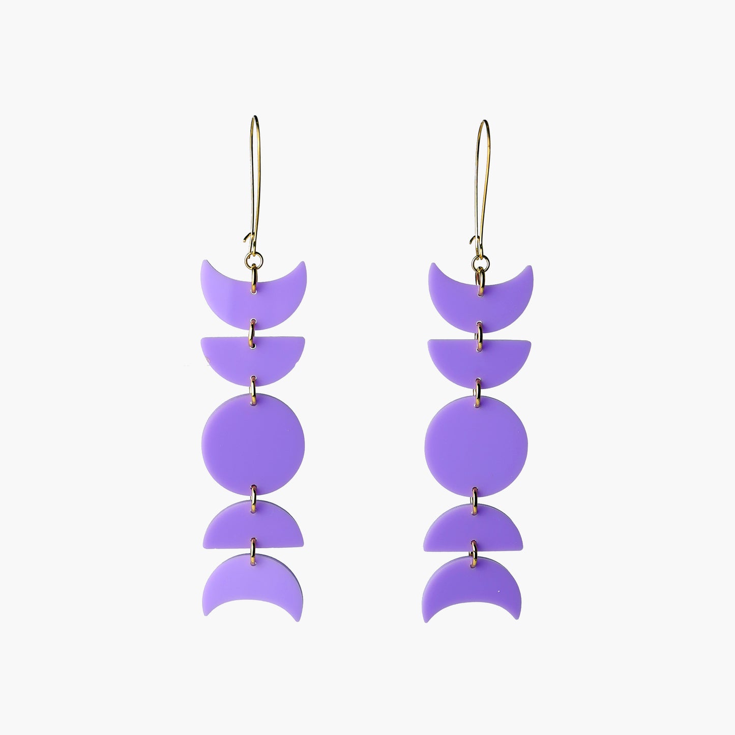 Front view image of Indi City Moonphase Earrings in purple acrylic. These long drop earrings beautifully capture a fusion of cultural and contemporary styles, symbolizing the ever-changing phases of the moon.