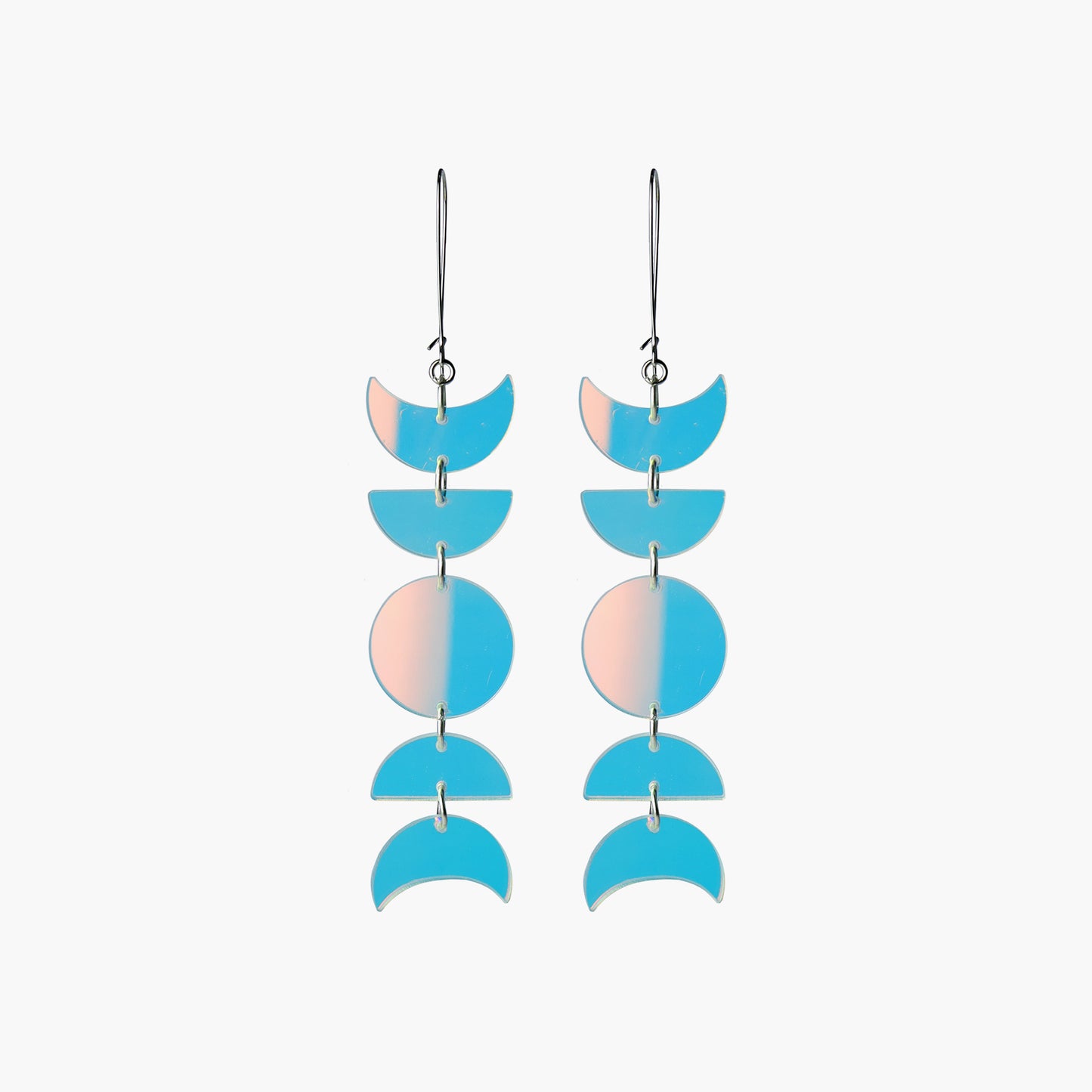 Front view image of Indi City Moonphase Earrings in iridescent transparent acrylic. These long drop earrings beautifully capture a fusion of cultural and contemporary styles, symbolizing the ever-changing phases of the moon.