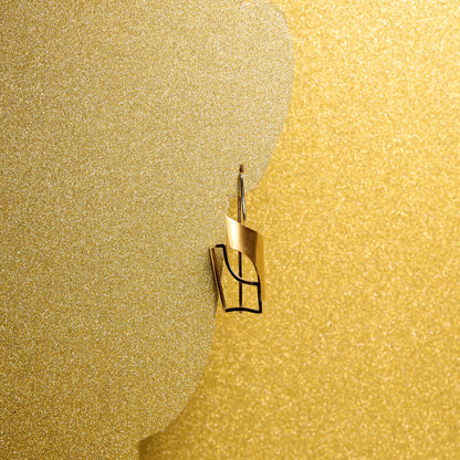 Zang Tumb Tumb earrings by Therese Cruz: A masterpiece of 18k yellow and palladium white gold, inspired by Dadaism and Marinetti's poem. Captivating interplay of geometric shapes and lines, making a bold statement.