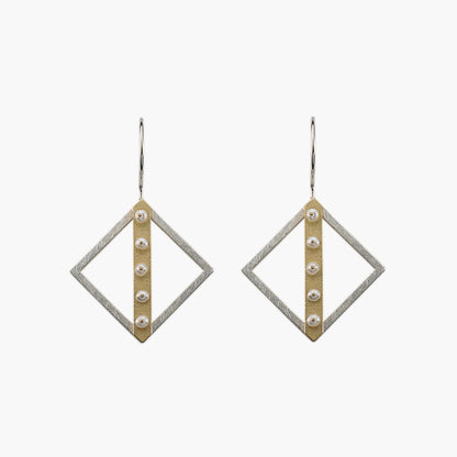 Sterling silver diamond-shaped earrings with gold line and pearl accents.