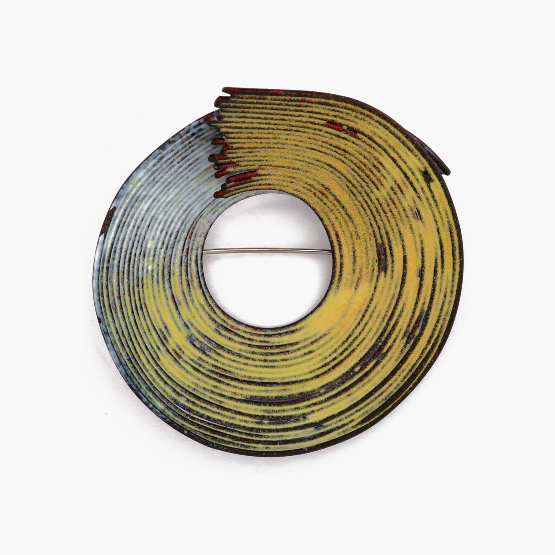 Front view of a brooch made of fine wires of enameled steel in yellow and white. The wires are arranged in a looping, organic shape that evokes the fluidity of brushstrokes in a painting. The brooch is work of jewellery artist Kye-Yeon Son